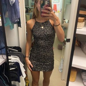 Black and gold tight mini dress